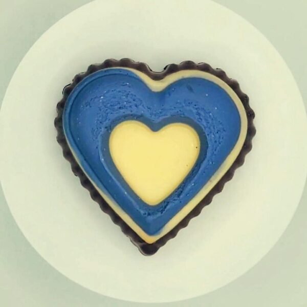 Heart-shaped cupcake soap with chocolate and black raspberry fragrance, offering a moisturizing lather for soft, nourished skin