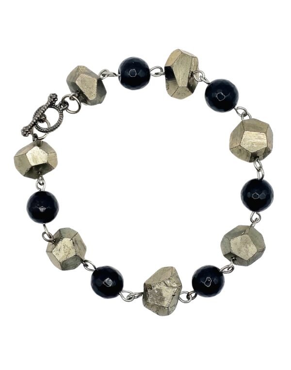Handcrafted Black Onyx and Pyrite bracelet with natural stones, promoting protection, healing, abundance, and spiritual growth for emotional stability and prosperity