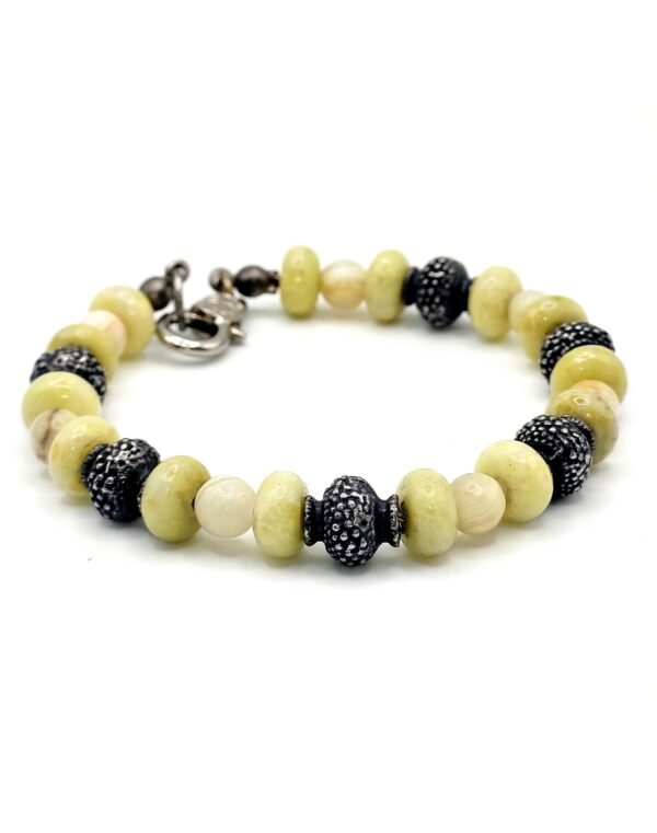 Handcrafted Mexican White Onyx and Andean Green Opal bracelet, promoting stability, emotional healing, renewal, and motivation with natural gemstones.