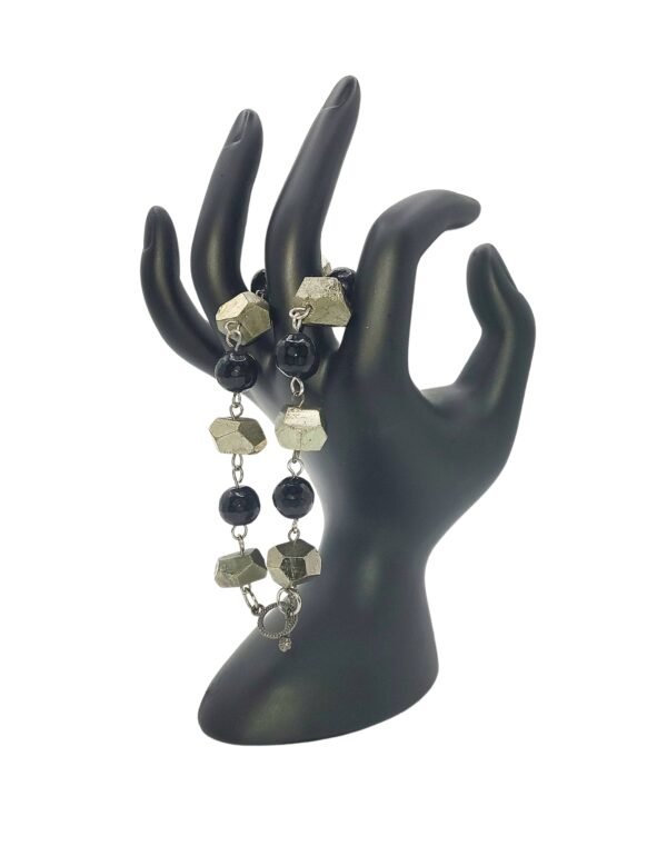 Handcrafted Black Onyx and Pyrite bracelet with natural stones, promoting protection, healing, abundance, and spiritual growth for emotional stability and prosperity