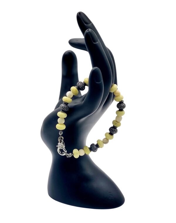 Handcrafted Mexican White Onyx and Andean Green Opal bracelet, promoting stability, emotional healing, renewal, and motivation with natural gemstones.
