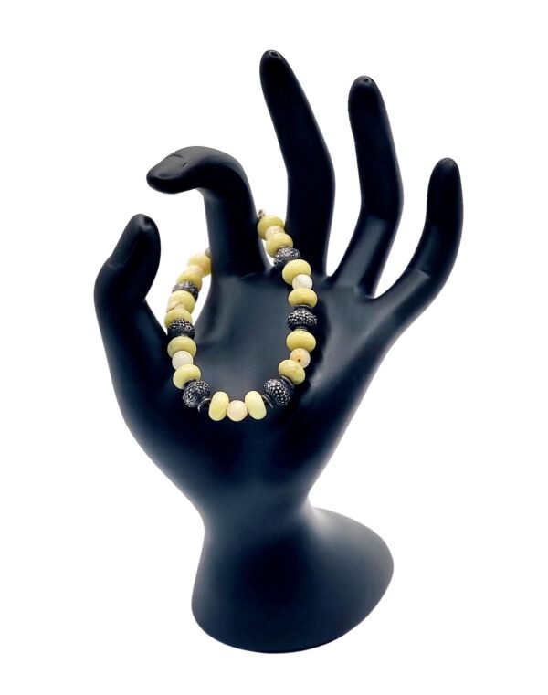 Handcrafted Mexican White Onyx and Andean Green Opal bracelet, promoting stability, emotional healing, renewal, and motivation with natural gemstones.